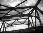 the country and the planet is dotted with towns like fall river and new bedford and these towns have roads and rivers requiring bridges, bathed in light and shadow. my camera tilted, with careful contrast, i grab at the trusses like a baby grabs a bonnet.